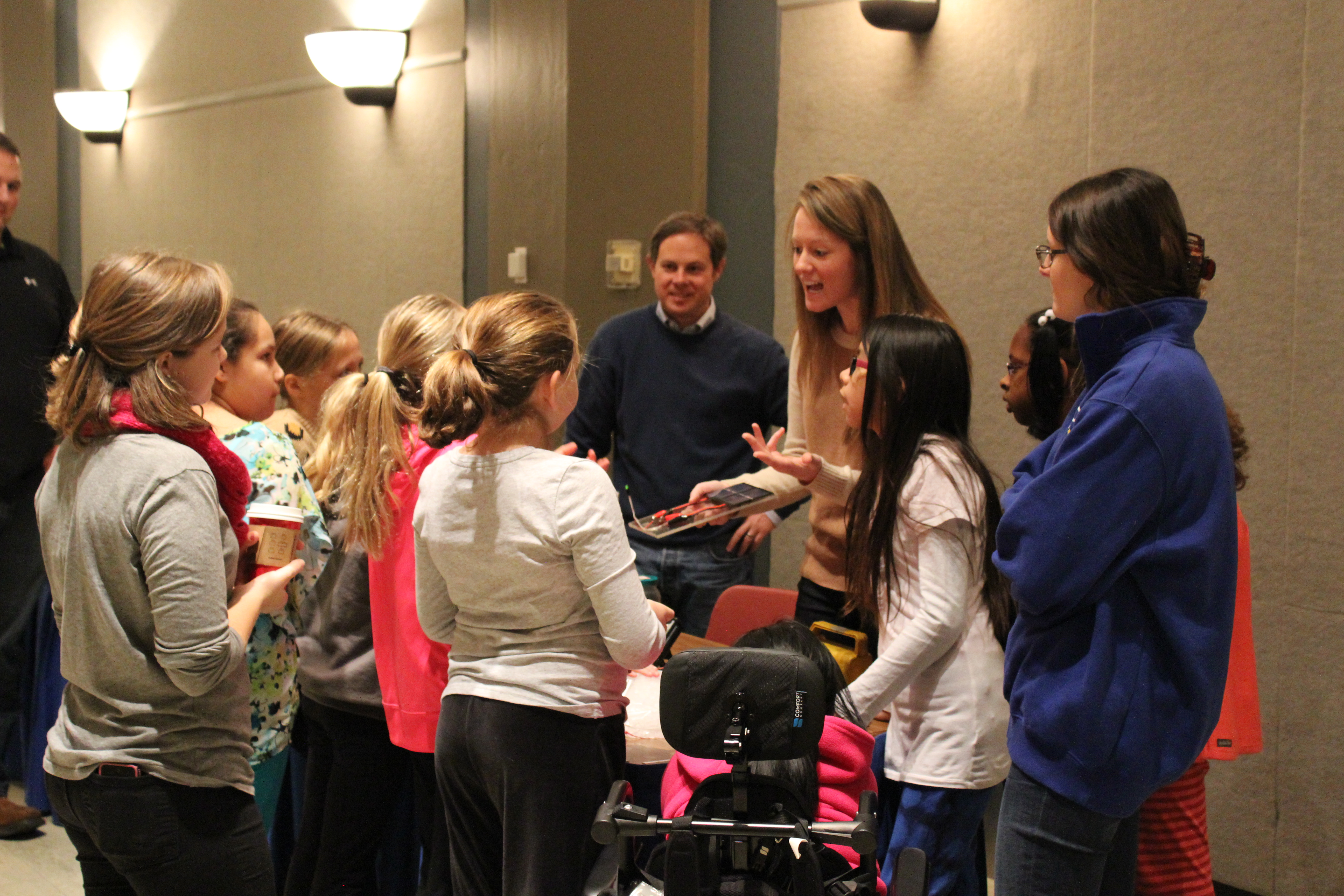 Ashley Morris, a senior research engineer at UK CAER, does a demonstration for fourth and fifth grade students at the Energy Fair Dec. 9 in the UK Student Center Grand Ballroom.